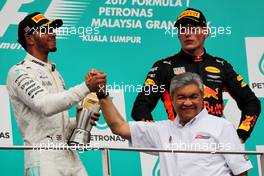 The podium (L to R): second placed Lewis Hamilton (GBR) Mercedes AMG F1 with race winner Max Verstappen (NLD) Red Bull Racing. 01.10.2017. Formula 1 World Championship, Rd 15, Malaysian Grand Prix, Sepang, Malaysia, Sunday.