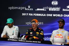 The post race FIA Press Conference (L to R): Lewis Hamilton (GBR) Mercedes AMG F1, second; Max Verstappen (NLD) Red Bull Racing, race winner; Daniel Ricciardo (AUS) Red Bull Racing, third. 01.10.2017. Formula 1 World Championship, Rd 15, Malaysian Grand Prix, Sepang, Malaysia, Sunday.