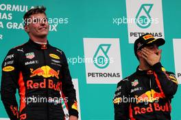 (L to R): Race winner Max Verstappen (NLD) Red Bull Racing celebrates on the podium with team mate Daniel Ricciardo (AUS) Red Bull Racing. 01.10.2017. Formula 1 World Championship, Rd 15, Malaysian Grand Prix, Sepang, Malaysia, Sunday.