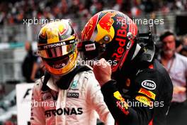 Race winner Max Verstappen (NLD) Red Bull Racing celebrates with second placed Lewis Hamilton (GBR) Mercedes AMG F1 in parc ferme. 01.10.2017. Formula 1 World Championship, Rd 15, Malaysian Grand Prix, Sepang, Malaysia, Sunday.