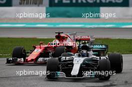Valtteri Bottas (FIN) Mercedes AMG F1 W08 leads Sebastian Vettel (GER) Ferrari SF70H. 01.10.2017. Formula 1 World Championship, Rd 15, Malaysian Grand Prix, Sepang, Malaysia, Sunday.