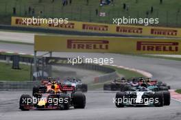 (L to R): Max Verstappen (NLD) Red Bull Racing RB13 and Valtteri Bottas (FIN) Mercedes AMG F1 W08 at the start of the race. 01.10.2017. Formula 1 World Championship, Rd 15, Malaysian Grand Prix, Sepang, Malaysia, Sunday.