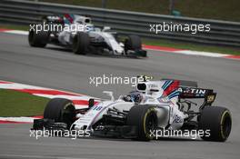 Lance Stroll (CDN) Williams FW40 and Felipe Massa (BRA) Williams FW40.  01.10.2017. Formula 1 World Championship, Rd 15, Malaysian Grand Prix, Sepang, Malaysia, Sunday.