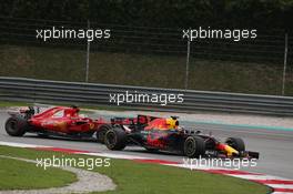 Daniel Ricciardo (AUS) Red Bull Racing RB13 and Sebastian Vettel (GER) Ferrari SF70H. 01.10.2017. Formula 1 World Championship, Rd 15, Malaysian Grand Prix, Sepang, Malaysia, Sunday.