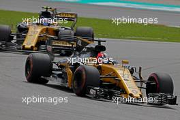 Nico Hulkenberg (GER) Renault Sport F1 Team and Jolyon Palmer (GBR) Renault Sport F1 Team   01.10.2017. Formula 1 World Championship, Rd 15, Malaysian Grand Prix, Sepang, Malaysia, Sunday.