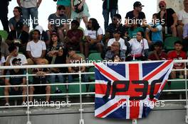 fans in the grandstand and a flag for Jolyon Palmer (GBR) Renault Sport F1 Team. 30.09.2017. Formula 1 World Championship, Rd 15, Malaysian Grand Prix, Sepang, Malaysia, Saturday.