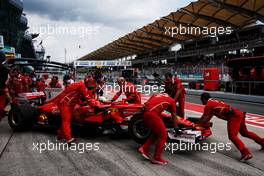 Sebastian Vettel (GER) Ferrari SF70H in the pits. 30.09.2017. Formula 1 World Championship, Rd 15, Malaysian Grand Prix, Sepang, Malaysia, Saturday.