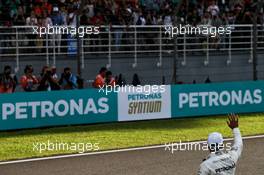 Lewis Hamilton (GBR) Mercedes AMG F1 celebrates his pole position with the fans in parc ferme. 30.09.2017. Formula 1 World Championship, Rd 15, Malaysian Grand Prix, Sepang, Malaysia, Saturday.