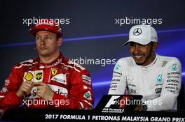 (L to R): Kimi Raikkonen (FIN) Ferrari and Lewis Hamilton (GBR) Mercedes AMG F1 in the post qualifying FIA Press Conference. 30.09.2017. Formula 1 World Championship, Rd 15, Malaysian Grand Prix, Sepang, Malaysia, Saturday.