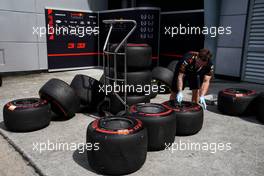 Red Bull Racing mechanic with Pirelli tyres.