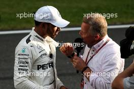 (L to R): Pole sitter Lewis Hamilton (GBR) Mercedes AMG F1 with Johnny Herbert (GBR) Sky Sports F1 Presenter in parc ferme. 30.09.2017. Formula 1 World Championship, Rd 15, Malaysian Grand Prix, Sepang, Malaysia, Saturday.