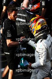 Lewis Hamilton (GBR) Mercedes AMG F1 celebrates his pole position in parc ferme with the team. 30.09.2017. Formula 1 World Championship, Rd 15, Malaysian Grand Prix, Sepang, Malaysia, Saturday.