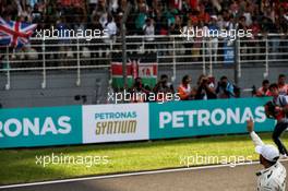 Lewis Hamilton (GBR) Mercedes AMG F1 celebrates his pole position with the fans in parc ferme. 30.09.2017. Formula 1 World Championship, Rd 15, Malaysian Grand Prix, Sepang, Malaysia, Saturday.