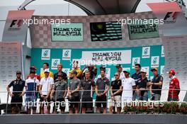 The drivers on the podium say thank you to Malaysia and its Grand Prix. 01.10.2017. Formula 1 World Championship, Rd 15, Malaysian Grand Prix, Sepang, Malaysia, Sunday.