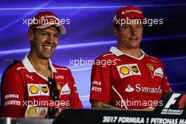 (L to R): Sebastian Vettel (GER) Ferrari with Kimi Raikkonen (FIN) Ferrari in the FIA Press Conference. 28.09.2017. Formula 1 World Championship, Rd 15, Malaysian Grand Prix, Sepang, Malaysia, Thursday.