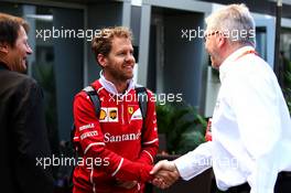 (L to R): Sebastian Vettel (GER) Ferrari with Ross Brawn (GBR) Managing Director, Motor Sports. 28.04.2017. Formula 1 World Championship, Rd 4, Russian Grand Prix, Sochi Autodrom, Sochi, Russia, Practice Day.