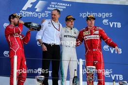 The podium (L to R): Sebastian Vettel (GER) Ferrari, second; Tony Ross (GBR) Mercedes AMG F1 Race Engineer; Valtteri Bottas (FIN) Mercedes AMG F1, race winner; Kimi Raikkonen (FIN) Ferrari, third. 30.04.2017. Formula 1 World Championship, Rd 4, Russian Grand Prix, Sochi Autodrom, Sochi, Russia, Race Day.