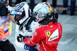 Race winner Valtteri Bottas (FIN) Mercedes AMG F1 celebrates in parc ferme with Sebastian Vettel (GER) Ferrari. 30.04.2017. Formula 1 World Championship, Rd 4, Russian Grand Prix, Sochi Autodrom, Sochi, Russia, Race Day.