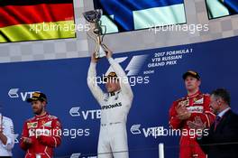 The podium (L to R): Sebastian Vettel (GER) Ferrari, second; Valtteri Bottas (FIN) Mercedes AMG F1, race winner; Kimi Raikkonen (FIN) Ferrari, third. 30.04.2017. Formula 1 World Championship, Rd 4, Russian Grand Prix, Sochi Autodrom, Sochi, Russia, Race Day.