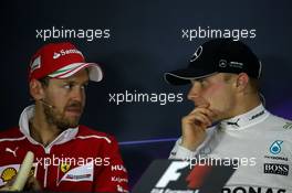 (L to R): Sebastian Vettel (GER) Ferrari and Valtteri Bottas (FIN) Mercedes AMG F1 in the FIA Press Conference. 30.04.2017. Formula 1 World Championship, Rd 4, Russian Grand Prix, Sochi Autodrom, Sochi, Russia, Race Day.