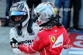 Race winner Valtteri Bottas (FIN) Mercedes AMG F1 celebrates in parc ferme with second placed Sebastian Vettel (GER) Ferrari. 30.04.2017. Formula 1 World Championship, Rd 4, Russian Grand Prix, Sochi Autodrom, Sochi, Russia, Race Day.