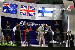 The podium (L to R): Daniel Ricciardo (AUS) Red Bull Racing, second; Lewis Hamilton (GBR) Mercedes AMG F1, race winner; Valtteri Bottas (FIN) Mercedes AMG F1, third. 17.09.2017. Formula 1 World Championship, Rd 14, Singapore Grand Prix, Marina Bay Street Circuit, Singapore, Race Day.