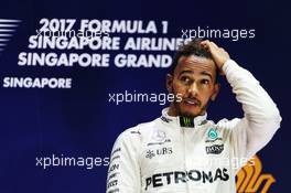 Race winner Lewis Hamilton (GBR) Mercedes AMG F1 on the podium. 17.09.2017. Formula 1 World Championship, Rd 14, Singapore Grand Prix, Marina Bay Street Circuit, Singapore, Race Day.