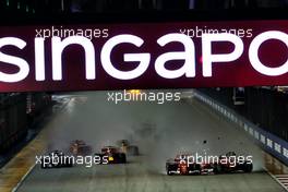 Sebastian Vettel (GER) Ferrari SF70H, Kimi Raikkonen (FIN) Ferrari SF70H, and Max Verstappen (NLD) Red Bull Racing RB13, crash at the start of the race. 17.09.2017. Formula 1 World Championship, Rd 14, Singapore Grand Prix, Marina Bay Street Circuit, Singapore, Race Day.