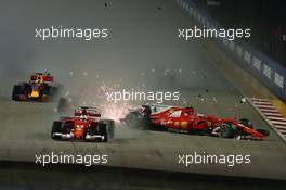 Sebastian Vettel (GER) Ferrari SF70H, Kimi Raikkonen (FIN) Ferrari SF70H, and Max Verstappen (NLD) Red Bull Racing RB13, crash at the start of the race 17.09.2017. Formula 1 World Championship, Rd 14, Singapore Grand Prix, Marina Bay Street Circuit, Singapore, Race Day.