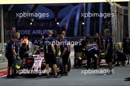 (L to R): Sergio Perez (MEX) Sahara Force India F1 VJM10 and Esteban Ocon (FRA) Sahara Force India F1 VJM10 at the pit lane entrance. 16.09.2017. Formula 1 World Championship, Rd 14, Singapore Grand Prix, Marina Bay Street Circuit, Singapore, Qualifying Day.