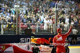 Sebastian Vettel (GER) Ferrari SF70H celebrates his pole position in qualifying parc ferme. 16.09.2017. Formula 1 World Championship, Rd 14, Singapore Grand Prix, Marina Bay Street Circuit, Singapore, Qualifying Day.