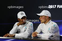 (L to R): Lewis Hamilton (GBR) Mercedes AMG F1 with Valtteri Bottas (FIN) Mercedes AMG F1 in the post race FIA Press Conference. 26.11.2017. Formula 1 World Championship, Rd 20, Abu Dhabi Grand Prix, Yas Marina Circuit, Abu Dhabi, Race Day.