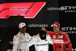 The podium (L to R): Lewis Hamilton (GBR) Mercedes AMG F1, second; Valtteri Bottas (FIN) Mercedes AMG F1, race winner; Sebastian Vettel (GER) Ferrari, third. 26.11.2017. Formula 1 World Championship, Rd 20, Abu Dhabi Grand Prix, Yas Marina Circuit, Abu Dhabi, Race Day.