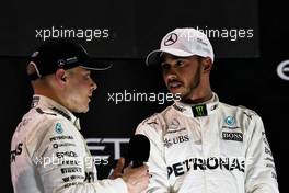 (L to R): Race winner Valtteri Bottas (FIN) Mercedes AMG F1 on the podium with team mate Lewis Hamilton (GBR) Mercedes AMG F1. 26.11.2017. Formula 1 World Championship, Rd 20, Abu Dhabi Grand Prix, Yas Marina Circuit, Abu Dhabi, Race Day.