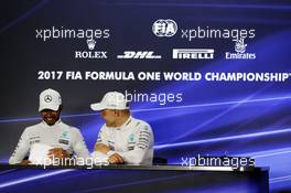 (L to R): Lewis Hamilton (GBR) Mercedes AMG F1 with Valtteri Bottas (FIN) Mercedes AMG F1 in the post race FIA Press Conference. 26.11.2017. Formula 1 World Championship, Rd 20, Abu Dhabi Grand Prix, Yas Marina Circuit, Abu Dhabi, Race Day.