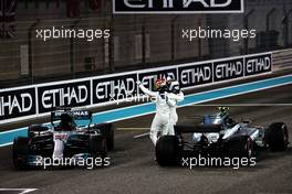 Race winner Valtteri Bottas (FIN) Mercedes AMG F1 (Right) celebrates with second placed team mate Lewis Hamilton (GBR) Mercedes AMG F1 in parc ferme. 26.11.2017. Formula 1 World Championship, Rd 20, Abu Dhabi Grand Prix, Yas Marina Circuit, Abu Dhabi, Race Day.