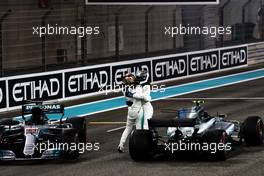 Race winner Valtteri Bottas (FIN) Mercedes AMG F1 (Right) celebrates with second placed team mate Lewis Hamilton (GBR) Mercedes AMG F1 in parc ferme. 26.11.2017. Formula 1 World Championship, Rd 20, Abu Dhabi Grand Prix, Yas Marina Circuit, Abu Dhabi, Race Day.
