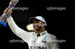 Lewis Hamilton (GBR) Mercedes AMG F1 celebrates his second position on the podium. 26.11.2017. Formula 1 World Championship, Rd 20, Abu Dhabi Grand Prix, Yas Marina Circuit, Abu Dhabi, Race Day.