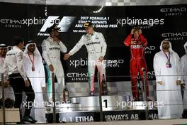 The podium (L to R): Lewis Hamilton (GBR) Mercedes AMG F1, second; Valtteri Bottas (FIN) Mercedes AMG F1, race winner; Sebastian Vettel (GER) Ferrari, third. 26.11.2017. Formula 1 World Championship, Rd 20, Abu Dhabi Grand Prix, Yas Marina Circuit, Abu Dhabi, Race Day.