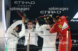 The podium (L to R): Race winner Valtteri Bottas (FIN) Mercedes AMG F1 with Lewis Hamilton (GBR) Mercedes AMG F1 and Sebastian Vettel (GER) Ferrari. 26.11.2017. Formula 1 World Championship, Rd 20, Abu Dhabi Grand Prix, Yas Marina Circuit, Abu Dhabi, Race Day.