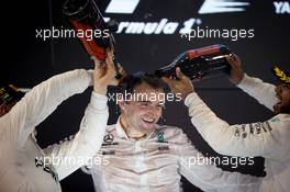 Race winner Valtteri Bottas (FIN) Mercedes AMG F1 celebrates on the podium with Lewis Hamilton (GBR) Mercedes AMG F1. 26.11.2017. Formula 1 World Championship, Rd 20, Abu Dhabi Grand Prix, Yas Marina Circuit, Abu Dhabi, Race Day.