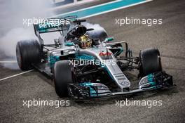 Lewis Hamilton (GBR) Mercedes AMG F1 W08 celebrates his second position at the end of the race with some doughnuts. 26.11.2017. Formula 1 World Championship, Rd 20, Abu Dhabi Grand Prix, Yas Marina Circuit, Abu Dhabi, Race Day.