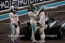 (L to R): Race winner Valtteri Bottas (FIN) Mercedes AMG F1 in parc ferme with Lewis Hamilton (GBR) Mercedes AMG F1 and Felipe Massa (BRA) Williams. 26.11.2017. Formula 1 World Championship, Rd 20, Abu Dhabi Grand Prix, Yas Marina Circuit, Abu Dhabi, Race Day.