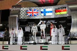 The podium (L to R): Lewis Hamilton (GBR) Mercedes AMG F1, second; Valtteri Bottas (FIN) Mercedes AMG F1, race winner; Sebastian Vettel (GER) Ferrari, third. 26.11.2017. Formula 1 World Championship, Rd 20, Abu Dhabi Grand Prix, Yas Marina Circuit, Abu Dhabi, Race Day.