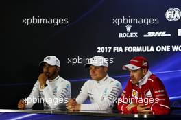 (L to R): Lewis Hamilton (GBR) Mercedes AMG F1, second; Valtteri Bottas (FIN) Mercedes AMG F1, race winner; Sebastian Vettel (GER) Ferrari, third, in the post race FIA Press Conference. 26.11.2017. Formula 1 World Championship, Rd 20, Abu Dhabi Grand Prix, Yas Marina Circuit, Abu Dhabi, Race Day.