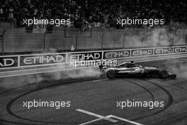 Second placed Lewis Hamilton (GBR) Mercedes AMG F1 W08 celebrates with doughnuts at the end of the race.                                26.11.2017. Formula 1 World Championship, Rd 20, Abu Dhabi Grand Prix, Yas Marina Circuit, Abu Dhabi, Race Day.