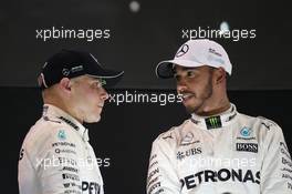 Valtteri Bottas (FIN) Mercedes AMG F1 W08 and Lewis Hamilton (GBR) Mercedes AMG F1 W08. 26.11.2017. Formula 1 World Championship, Rd 20, Abu Dhabi Grand Prix, Yas Marina Circuit, Abu Dhabi, Race Day.