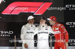 The podium - with new F1 logo - (L to R): Lewis Hamilton (GBR) Mercedes AMG F1, second; Valtteri Bottas (FIN) Mercedes AMG F1, race winner; Sebastian Vettel (GER) Ferrari, third and the new F1 logo. 26.11.2017. Formula 1 World Championship, Rd 20, Abu Dhabi Grand Prix, Yas Marina Circuit, Abu Dhabi, Race Day.
