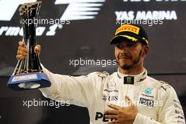Lewis Hamilton (GBR) Mercedes AMG F1 celebrates his second position on the podium. 26.11.2017. Formula 1 World Championship, Rd 20, Abu Dhabi Grand Prix, Yas Marina Circuit, Abu Dhabi, Race Day.