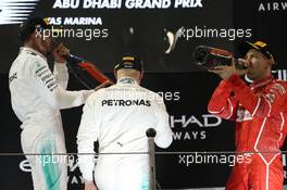 The podium - (L to R): Lewis Hamilton (GBR) Mercedes AMG F1, second; Valtteri Bottas (FIN) Mercedes AMG F1, race winner; Sebastian Vettel (GER) Ferrari, third. 26.11.2017. Formula 1 World Championship, Rd 20, Abu Dhabi Grand Prix, Yas Marina Circuit, Abu Dhabi, Race Day.